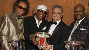 Pictured at the 2005 BMI Urban Awards are Robert Wilson and Charlie Wilson of the Gap Band; BMI President & CEO Del Bryant; and the Gap Band’s Ronnie Wilson.