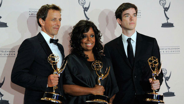 Katreese Barnes (center) celebrates with co-writers Seth Meyers (left) and John Mulaney at the 2011 Primetime Creative Arts Emmy Awards.