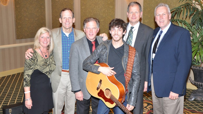 Pictured (L-R) after the show are:  Neuhoff Media-Decatur Promotions Director Tammy Moore, BMI’s Dan Spears,  Kaspar Broadcasting owner and conference host Russ Kaspar, BMI songwriter Chris Janson, Finger Lakes Broadcasting President Alan Bishop and Casper Radio Group General Manager Bob Breck.
