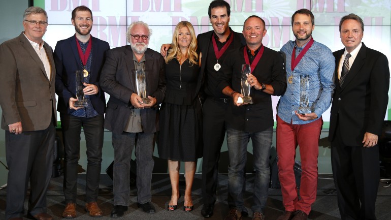 The night’s big winners gather for a photo at the 2014 BMI Christian Awards in Nashville. Pictured are (l-r): BMI's Phil Graham, Song of the Year writer Scott Cash, Publisher of the Year Eddie DeGarmo of Capitol CMG Publishing, BMI's Leslie Roberts, Song of the Year writer Ed Cash, Songwriter of the Year and Song of the Year writer Chris Tomlin, Songwriter of the Year Brandon Heath, and BMI's Jody Williams. 