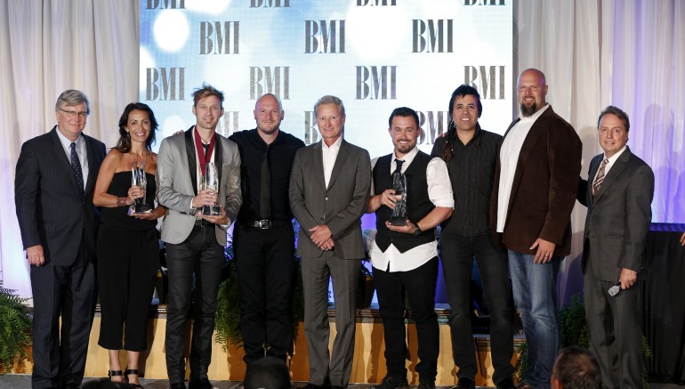 A look back at 2013: Building 429 accepts their Song of the Year award for “Where I Belong” at the 2013 BMI Christian Music Awards. Pictured are (l-r): BMI's Phil Graham, Provident Music Group's Holly Zabk, Building 429's Jason Roy and Aaron Branch, Provident Music Group's Terry Hemmings, Building 429's Michael Anderson and Jesse Garcia, Provident Music Group's Devon DeVries, and BMI's Jody Williams. 