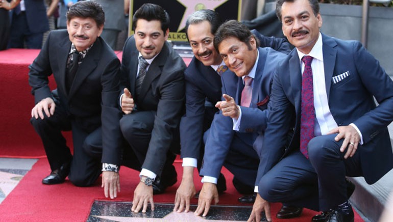 Pictured (L–R): Los Tigres del Norte members Oscar Lara, Luis Hernandez, Hernán Hernandez, Jorge Hernandez and Eduardo Hernandez, posing with their star on the Hollywood Walk of Fame.