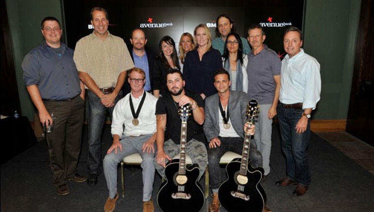 (L-R): (Front row) BMI songwriters John Ozier, Tyler Farr, and Phillip Larue. (Back row) Curb Music’s Colt Cameron, Sony ATV’s Tom Luteran, Curb Music’s Drew Alexander, Maxx Music Publishing’s Kristi Brazell, BMI’s Leslie Roberts, Razor & Tie’s Lisa Johnson, Ross Asher, Sharon Tapper and Craig Balsam and BMI’s Jody Williams.