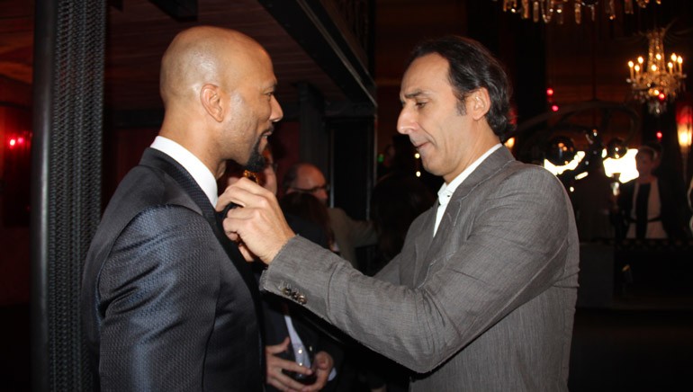 Pictured at the SCL reception on Saturday, February 21, 2015, at La Bohéme in West Hollywood, Calif. (L–R): 2015 Oscar winners Common and Alexandre Desplat.