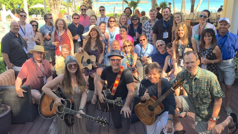 Attendees and songwriters gather for a photo at the Key West Songwriters Festival during a private reception for BMI customers.