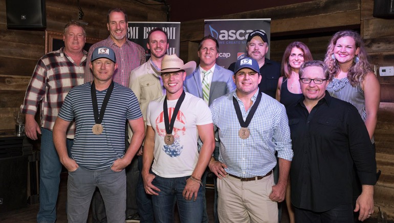Pictured: (L-R): Back Row: ASCAP’s Mike Sistad, Sony ATV’s Tom Luteran, This Music’s Rusty Gaston, Broken Bow Records’ Jon Loba, Warner/Chappell’s Ben Vaughn, Broken Bow Records’ Lee Adams and BMI’s Nina Carter. Front Row: Songwriter Ben Hayslip, BMI artist Dustin Lynch, BMI songwriter Rhett Akins and producer Mikey Jack Cones.