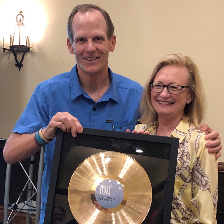 BMI’s Dan Spears presents NRA CEO Dawn Sweeney with a BMI gold record at the CSRA summer meeting in Sonoma.