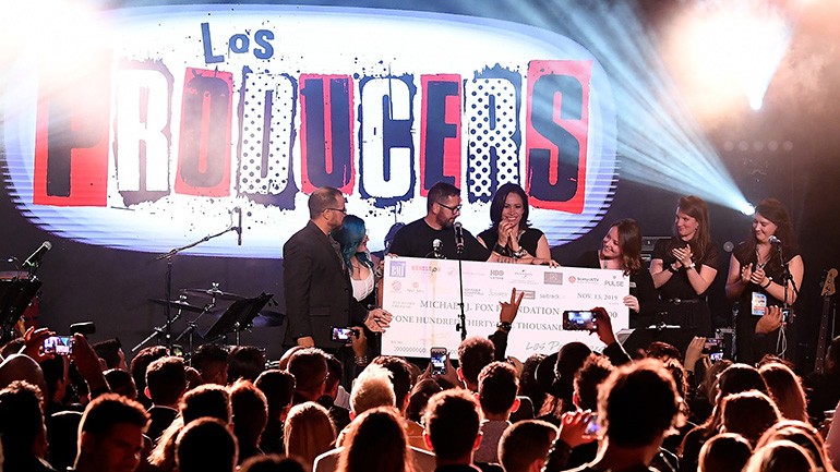 The 2019 Los Producers charity event raised more than $135,000 for the Michael J. Fox Foundation. On stage receiving the check are (L-R) BMI’s Joey Mercado and Mary Russe, Rebeleon Entertainment’s Sebastian Krys, BMI’s Alex Flores and the Foundation representatives.