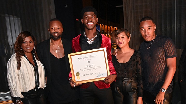 Lil Nas X celebrate his BMI “Million-Air” certificate in honor of “Old Town Road (Remix)” reaching over one million broadcast performances. Lil Nas X is pictured here with BMI Vice President Creative, Atlanta, Catherine Brewton, BMI Assistant Vice President Creative, Los Angeles, Wardell Malloy, and BMI’s Marché Butler and Reggie Stewart.
