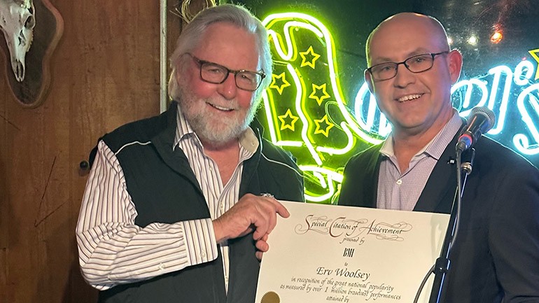 Erv Woolsey (L) and BMI's Mitch Ballard (R) celebrate the remarkable achievement of 