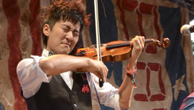 Pictured:  Kishi Bashi is kicking it on the BMI Stage at the Austin City Limits Festival.  