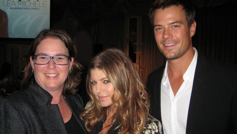 BMI’s Alison Smith (l), who was honored as a Top Power Player at Billboard’s Women in Music luncheon on December 2, pauses for a photo with fellow honoree Fergie and actor Josh Duhamel