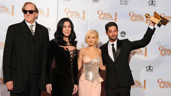 T-Bone Burnett, Cher, Christina Aguilera, and Ryan Bingham celebrate Burnett and Bingham’s Best Original Song win at the 2010 Golden Globe Awards in Hollywood. Cher and Aguilera presented awards in the music field.