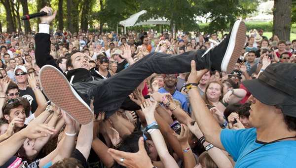 Pete Wentz of Black Cards frolics with festival-goers at BMI’s Lollapalooza stage, August 5 in Chicago.