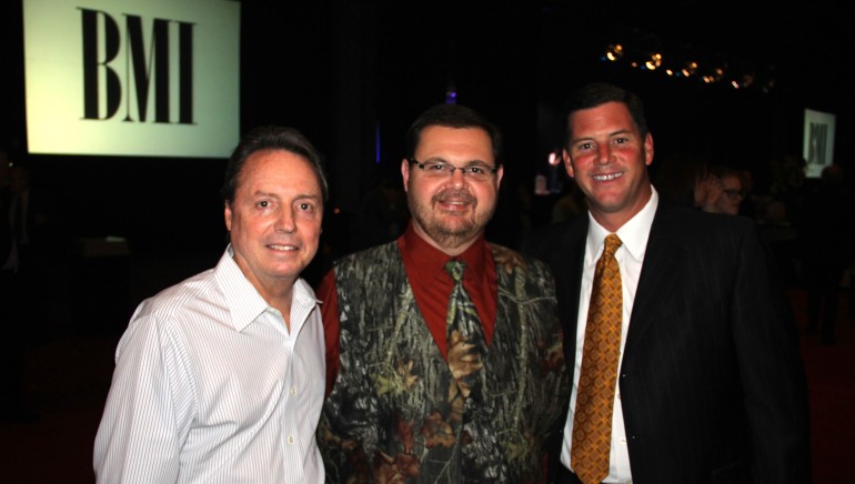 Pictured at the 2012 IBMA Awards Nominees Press Reception, sponsored by BMI, are BMI’s Jody Williams, Album of the Year and Song of the Year award winner Junior Sisk, and BMI’s Mark Mason.