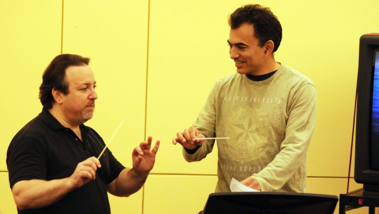 Pictured at 2011 Conducting for the Film Composer Workshop, presented by BMI: (L-R) Lucas Richman guides Daniel Hamuy thru a score.
