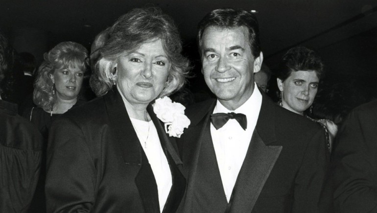 Former BMI President & CEO Frances Preston huddles for a photo with Dick Clark.