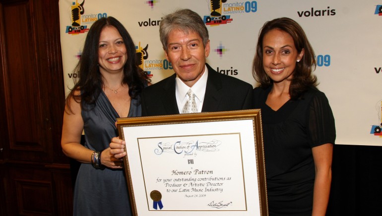 BMI honored Homero Patrón during Monitor Latino 2009. Pictured are BMI’s Darlene Rosado, Patrón and BMI’s Delia Orjuela.