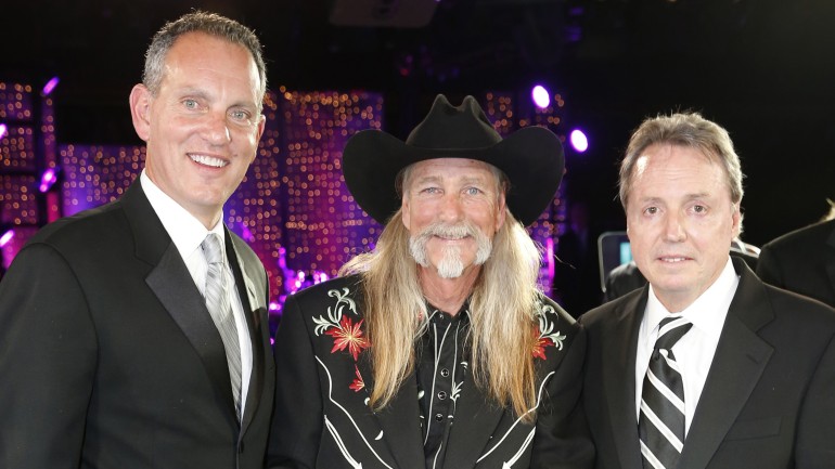 Dean Dillon is honored as a BMI Icon at the 2013 BMI Country Awards, held November 5 in Nashville. Pictured are (l-r): BMI CEO Mike O'Neill, Dean Dillon, and BMI's Jody Williams.