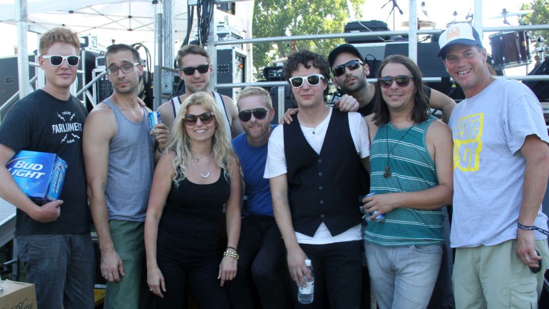 C3 Presents' Amy Corbin (third from left) joins BMI's Mark Mason (far right) and Space Capone backstage before the band's set on the BMI Loufest Stage Saturday afternoon.