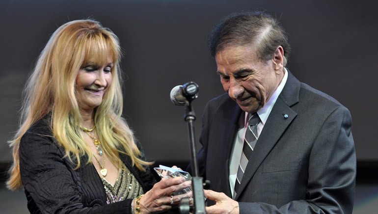 Richard Sherman on stage receiving his ETM-LA Shining Star Award at the ninth annual Education Through Music - Los Angeles gala at the Skirball Cultural Center.