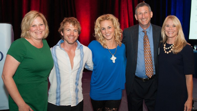 Pictured after her performance (l-r): NCAB Executive Director Lisa Reynolds, North Carolina guitarist Joey Boardwine, BMI songwriter Adley Stump, NCAB President and VP/GM of WRAL-TV Steve Hammel and BMI’s Amy Perdue.