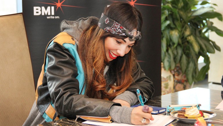 Singer/songwriter/actress Jackie Cruz officially signs with BMI at the Company's New York office.