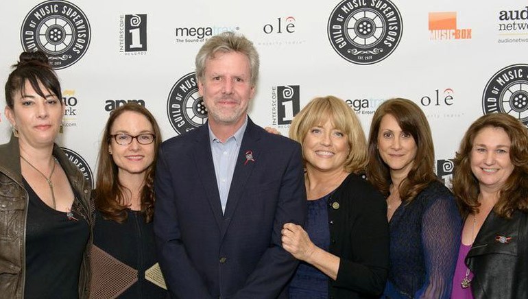Pictured L-R at the awards ceremony are: Music Supervisor Award nominee Amine Ramer, BMI Senior Director Film/TV Relations Lisa Feldman, Warner Brothers President of Music Paul Broucek, Guild President Maureen Crowe, Music Supervisor Award winner Robin Kaye and Disney's Vice President Creative of Music and Soundtracks Kaylin Frank.