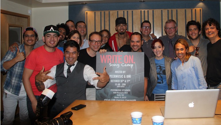 Pictured at the two-day songwriting camp at the peermusic office in Miami, Florida: Back row (L–R): Julca Brothers; Linkon; BMI Director, Latin Writer/Publisher Relations, Carolina Arenas; peermusic VP, Latin America Operations, Chema Escrina; Cynthia Bagué; Motiff; Juan Cristobal Losada; peermusic Chairman and CEO Ralph Peer II; Gustavo Galindo and Junior Cabral. Front row (L–R): Alcover; Bruno Danzza; peermusic VP, Latin Division East Coast and Puerto Rico, Julio Bagué; BMI Senior Director, Latin Writer/Publisher Relations, Joey Mercado; peermusic VP, Latin Division West Coast, Yvonne Drazan and BMI VP, Latin Writer/Publisher Relations, Delia Orjuela. 