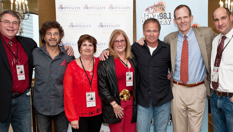 Pictured at the VIP reception held beforehand (left to right): H. Robert Bacon, RI Hospitality Association Chairman of the Board and Owner of Gregg’s Restaurants & Pubs; Phil O’Donnell; Diane Van Pelt, Co-Chairperson of Drink Red Wear Red Committee and Account Executive of Sprague Operating Resources LLC; Dale Venturini, CEO/President of Rhode Island Hospitality Association; Tim James; BMI’s  Dan Spears; and Joseph Vigliotti, Co-Chairperson of Drink Red Wear Red Committee and District Sales Manager of US Foods.