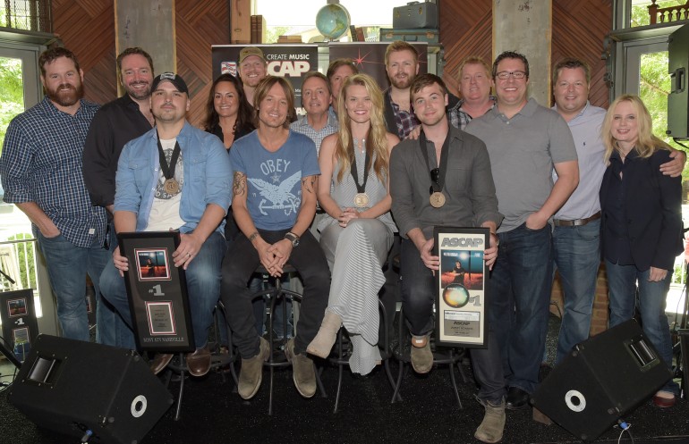 (L-R): (Back row) UMG’s Royce Risser, Sony/ATV Tree’s Josh VanValkenburg, ASCAP’s LeAnn Phelan, producer Nathan Chapman, BMI’s Jody Williams, UMG’s Joe Fisher, Warner/Chappell’s BJ HIll, ASCAP’s Mike Sistad, Universal Publishing’s Kent Earls, BMI’s Bradley Collins and UMG’s Cindy Mabe. (Front row): Jon Nite, Keith Urban, BMI songwriter Nicolle Galyon and Jimmy Robbins.