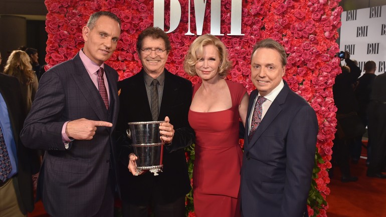 Pictured: (L-R): BMI's Mike O'Neill, BMI songwriter and Icon Mac Davis with his wife Lise Davis and BMI's Jody Williams. 