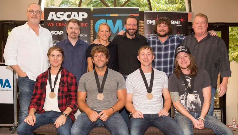 Pictured (L-R) back row: Universal Record’s Mike Dungan, Amylase’s Ben Vaughn, BMI’s Leslie Roberts, Sony/ATV’s Josh Van Valkenburg, Combustion Music’s Chris VanBelkom and ASCAP’s Mike Sistad. Front row: BMI songwriter Ross Copperman, Billy Currington, songwriters Ashley Gorley and Jaren Johnston.