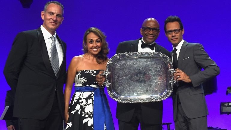 BMI President and CEO Mike O’Neill (L) and BMI Vice President, Latin Music Delia Orjuela (2nd from left) and Marc Anthony (far right) present producer, pianist and composer Sergio George with the 2015 BMI President’s award at the 22nd annual BMI Latin Awards held at the Fontainebleau Hotel in Miami Beach, Florida.