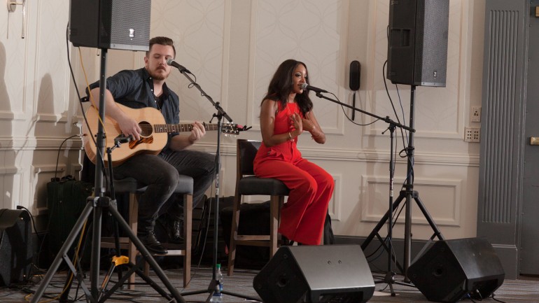 Guitarist Aaron Lagrone and Mickey Guyton during the performance.