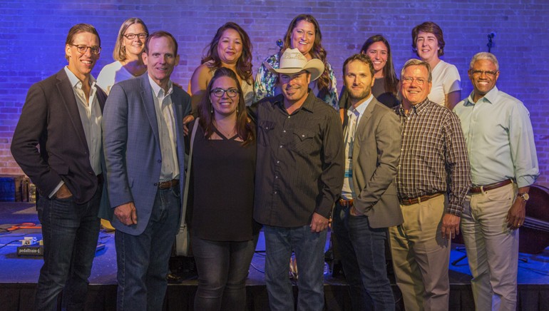 Pictured (L-R) after the performance are: NRA VP of Membership Tom Wojno,  NRA EVP of Convention and Strategic Alliances Mary Pat Heftman, BMI’s Dan Spears, NRA VP of Sponsorships Kathie Vu, NRA Senior Marketing Manager of Innovation & Entrepreneurship Anna Tauzin, BSOJC lead singer Mark Stuart, NRA Event and Sponsor Marketing Specialist Jaclyn Sanford, AMEX/Plenti VP of Business Development Richard Wolfman, AMEX Senior Manager of Restaurant Industry Development Silvia Pazfrydman, Texas Restaurant Association President Richie Jackson, NRA EVP of Marketing & Membership Deb Billow and NRA Chief Information Officer Kevin Steele.