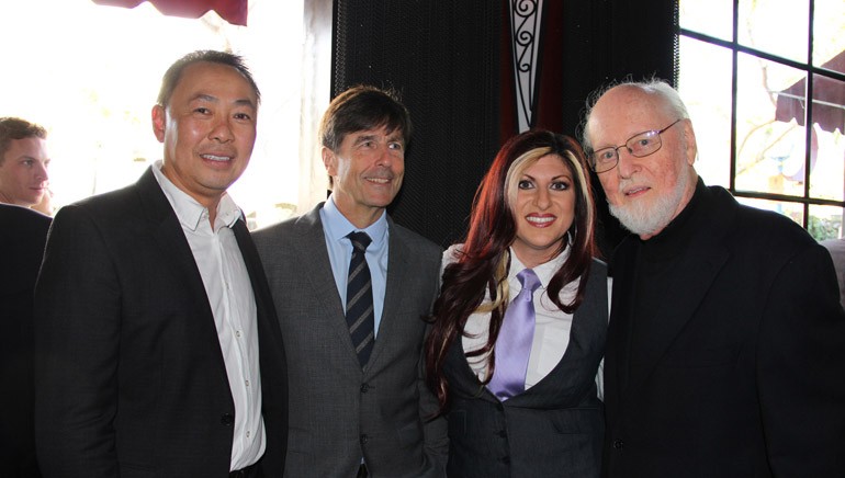 BMI Assistant Vice President of Film/TV Relations, Ray Yee; BMI composer Thomas Newman; BMI Director Film/TV Relations, Anne Cecere; and BMI Composer John Williams smile for a photo during the SCL Champagne Reception.