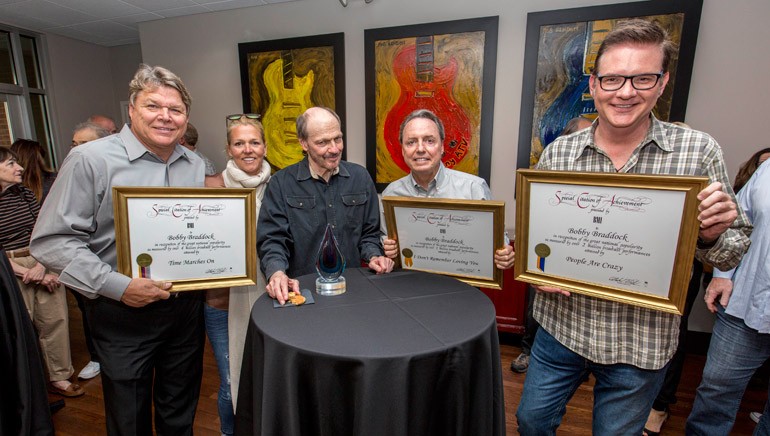 Pictured: (L-R): BMI’s David Preston and Leslie Roberts, BMI songwriter Bobby Braddock and BMI’s Jody Williams and Perry Howard.