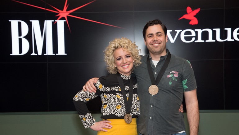 BMI songwriters Cam and Tyler Johnson pose post-party with their #1 medallions from the CMA.