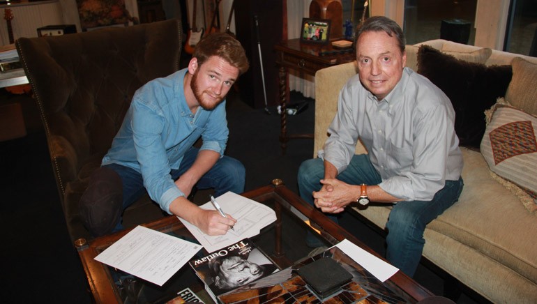 Pictured: Newly signed BMI songwriter Ben Haggard and BMI’s Jody Williams pose for a photo in Jody’s office.