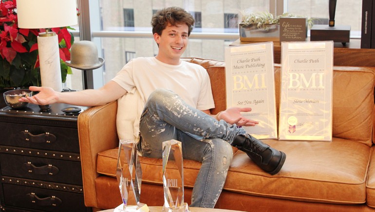 BMI songwriter Charlie Puth with the BMI R&B/Hip-Hop awards he won for “Slow Motion” and “See You Again.”