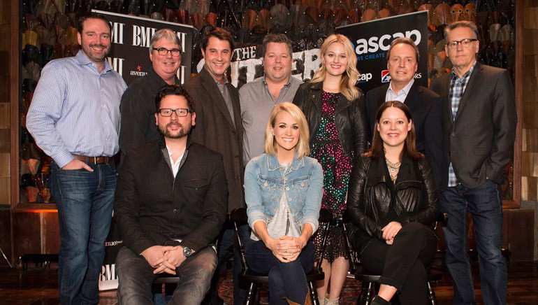 Pictured: (L-R): Back Row: Sony ATV’s Josh Van Valkenburg, BMG’s Chris Oglesby, ASCAP’s Michael Martin, BMI’s Bradly Collins, ASCAP’s Beth Brinker, BMI’s Jody Williams and Arista Nashville’s Randy Goodman. Front Row: Songwriter Chris DeStefano, BMI songwriter Carrie Underwood and songwriter Hillary Lindsey.