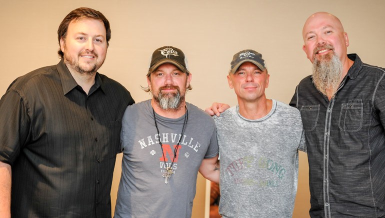 BMI’s Mason Hunter, BMI songwriter Keith Gattis, BMI recording artist and songwriter Kenny Chesney and BMI songwriter Kendell Marvel pose for a photo at the Texas Roadhouse Managing Partners Conference.