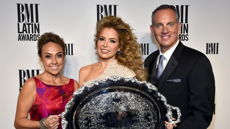 (L-R) BMI Vice President, Writer/Publisher Relations, Latin Music Delia Orjuela; honoree Gloria Trevi with the 2016 BMI President’s Award; and BMI President & CEO Mike O’Neill attend the 23rd Annual BMI Latin Awards at the Beverly Wilshire Four Seasons Hotel on March 2, 2016 in Beverly Hills, California.