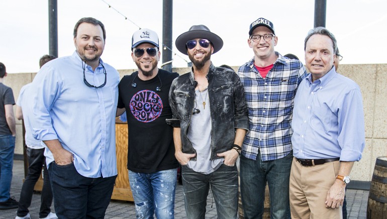 BMI’s Mason Hunter, BMI songwriters and members of LOCASH Chris Lucas and Preston Brust, George Dickel’s Brian Downing and BMI’s Jody Williams pose together at the BMI Rooftop Series show.