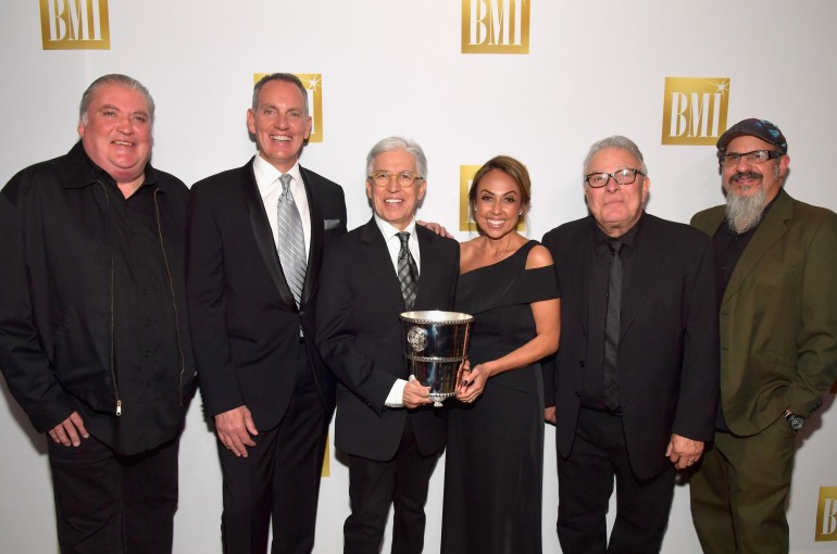 BMI President and Chief Executive Officer Michael O’Neill (2nd from L) and BMI Vice President, Latin Writer-Publisher Relations, Los Angeles Delia Orjuela (3rd from R) pose with honorees (from L) David Hidalgo, Louie Perez, Conrad Lozano, and Steve Berlin of music group Los Lobos.