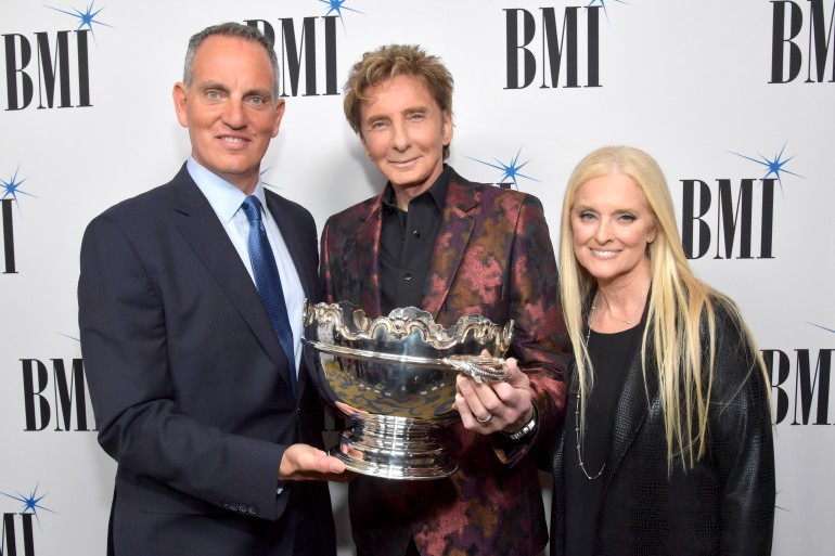 (L-R) BMI President and CEO Michael O'Neill, 2017 BMI Icon Award recipient Barry Manilow and BMI vice president and general manager, writer/publisher relations Barbara Cane at BMI honors Barry Manilow at the 65th Annual BMI Pop Awards