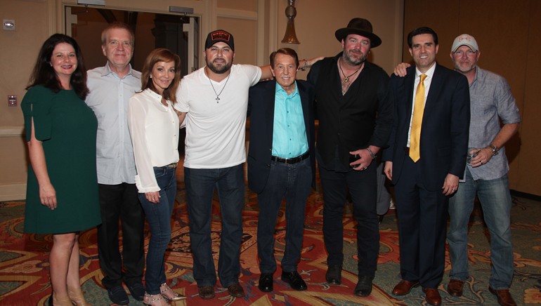Pictured (L-R) are BMI’s Jessica Frost, BBGI VP of Programming Buzz Knight, BBGI CEO and BMI Board Member Caroline Beasley, BMI songwriter and Columbia Nashville recording artist Tyler Farr, BBGI Chairman George Beasley, Curb recording artist and BMI songwriter Lee Brice, BBGI EVP of Programming Justin Chase and BBGI Country Format Captain and WSOC Charlotte Operations Manager DJ Stout.