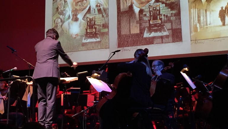 Renowned composer Thomas Newman expertly conducts the Golden State Pops Orchestra as images from “The Green Mile” fill the room at “The Magnificent Movie Poster World of Drew Struzan.”