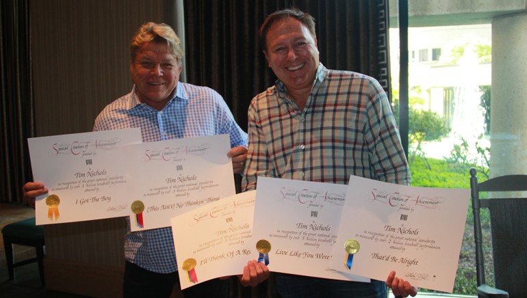 BMI’s David Preston and BMI songwriter Tim Nichols celebrate Tim’s Million-Air awards.